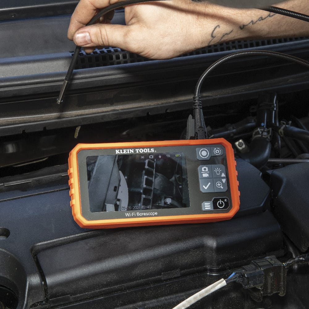 Close-up of the ET19 Pro with the USB-C charging and data cable connected. The image highlights the modern interface used for high-speed file transfer of 720p inspection videos and the protective weather-resistant port seal.