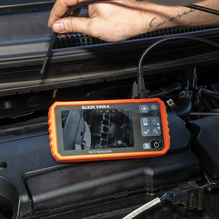 Close-up of the ET19 Pro with the USB-C charging and data cable connected. The image highlights the modern interface used for high-speed file transfer of 720p inspection videos and the protective weather-resistant port seal.