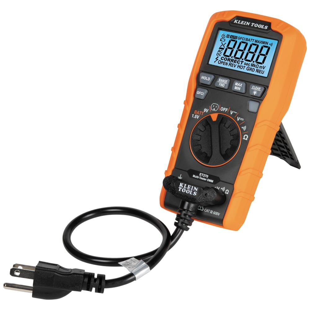 Perspective view of the Klein Tools ET270 with its integrated kickstand deployed for hands-free viewing. The specialized GFCI receptacle test cord is plugged into the bottom input jacks, illustrating the secure connection for outlet diagnostics.