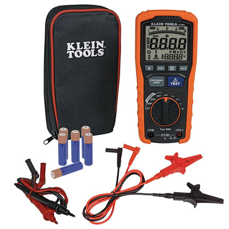 A studio kit shot of the Klein Tools ET600 system. The professional diagnostic package includes the digital megohmmeter, a set of red and black safety-rated test leads, heavy-duty alligator clips, six AA alkaline batteries, and a zippered black and orange storage case.