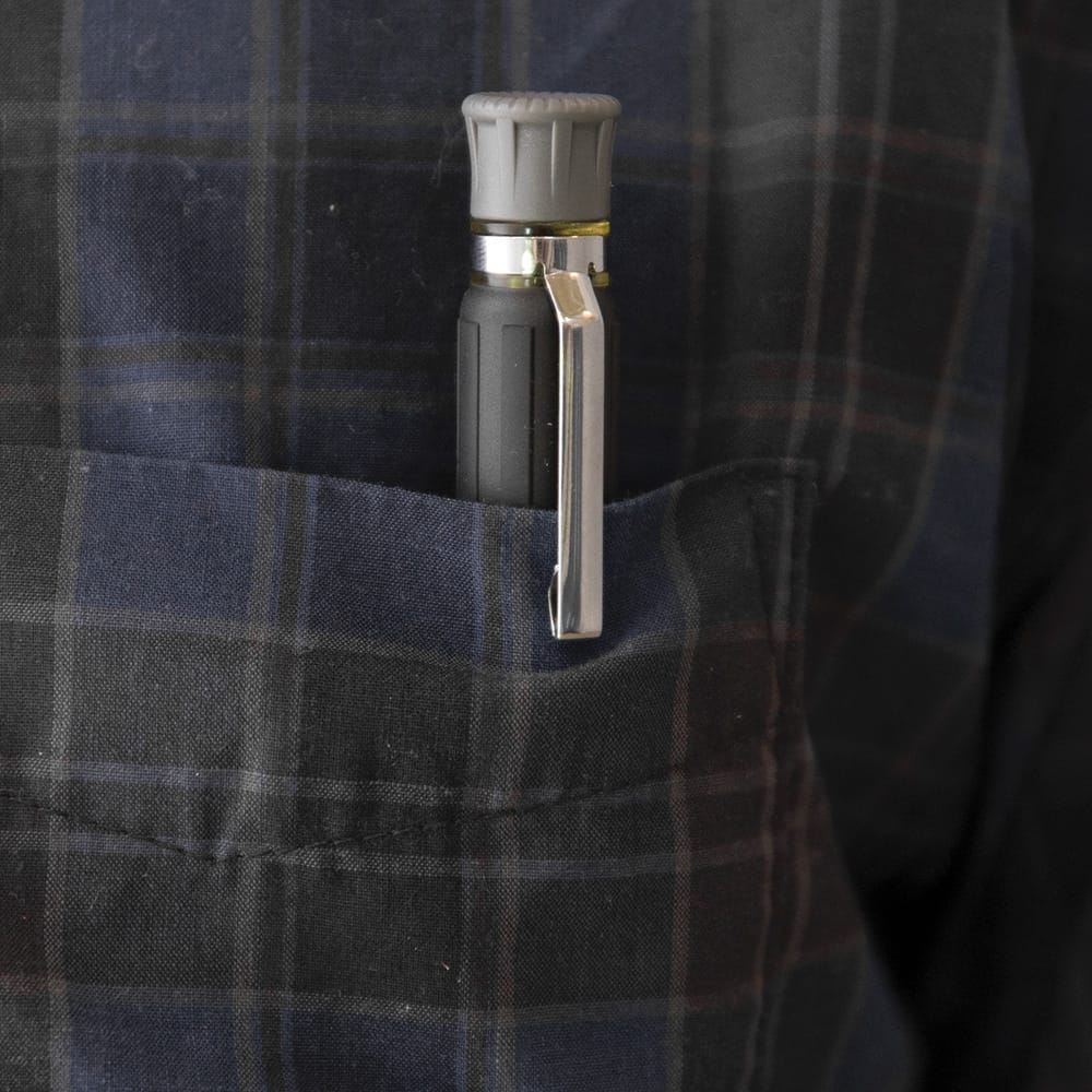 Klein 32614 precision driver clipped into a shirt pocket with its tip fully concealed by the sliding collar to prevent fabric tears.