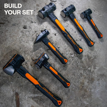 Lineup of six Klein Tools striking hammers resting on concrete to display available head weight and handle length variations.