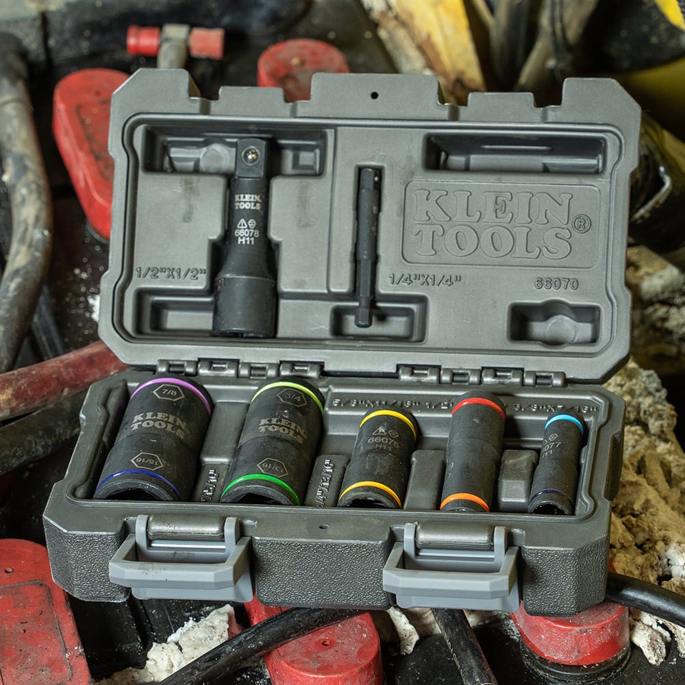 Klein 66070 flip impact socket storage kit open on a jobsite showing five color-coded flip sockets and the 66078 large adapter.