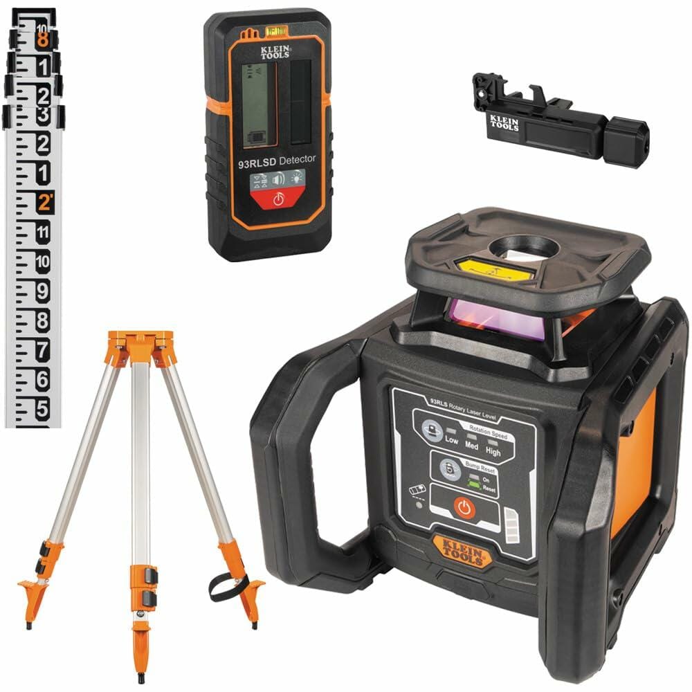 Complete Klein Tools rotary laser level kit including laser unit, detector, receiver bracket, leveling rod, and tripod arranged for jobsite use.