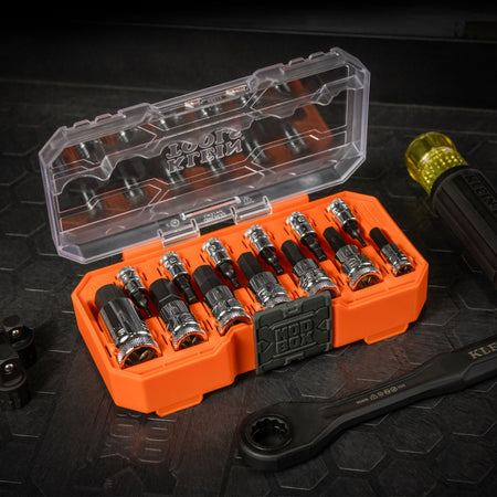 Klein 65213HEX set open on a jobsite workbench alongside a Cushion-Grip handle and pass-through wrench for flexible driving options.