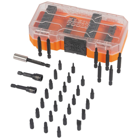 Klein 33800 impact set components laid out in front of the clear-lid MODbox storage case, displaying all 35 bits, nut drivers, and extension.
