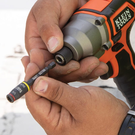 Technician inserting the 1/4-inch quick-connect shank of the Klein 32766 flip socket directly into a power impact driver chuck.