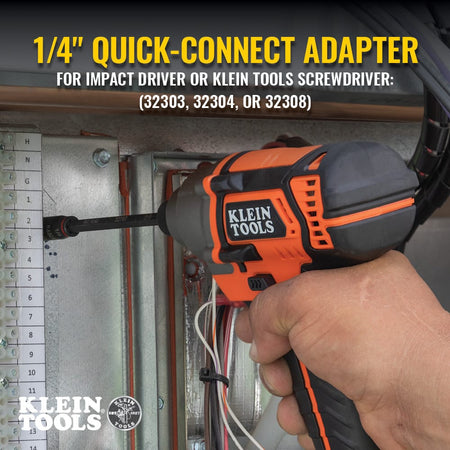 Electrician using the 3-inch Klein 32766 flip socket on an impact driver to secure ground terminal screws in a panel.