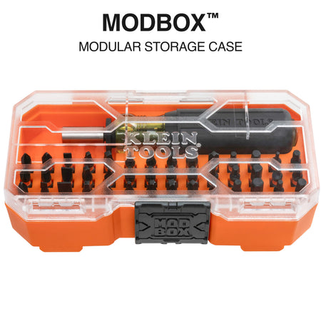 Closed Klein MODbox modular storage case showing transparent lid, stay-shut front latch, and internal bit tray layout.