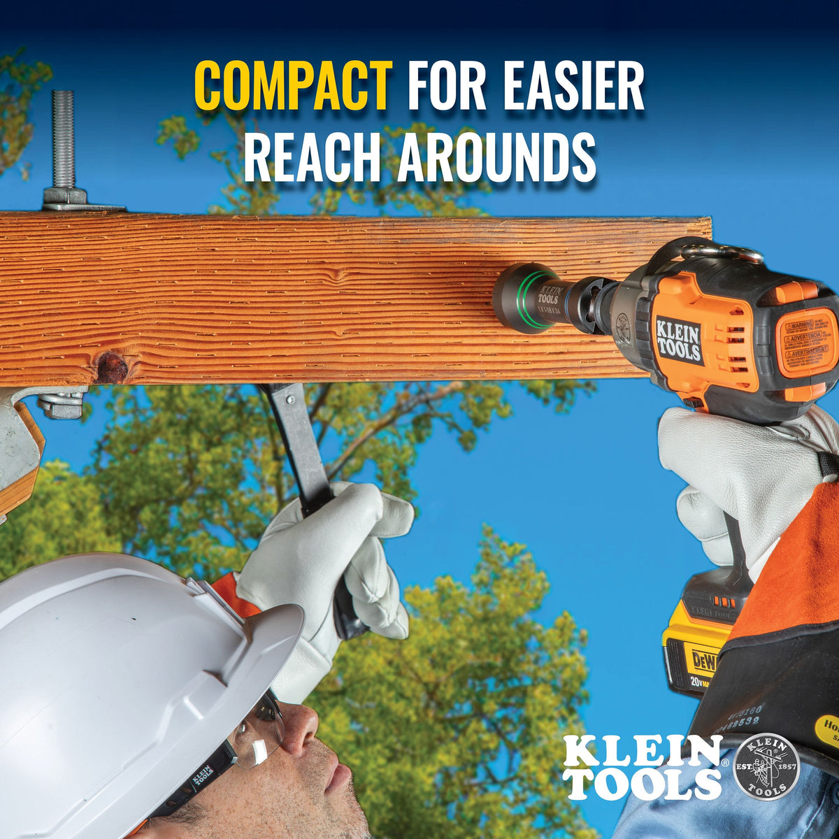 Lineman using compact Klein NRHDM socket on an impact driver to fasten pole hardware in tight crossarm clearances.