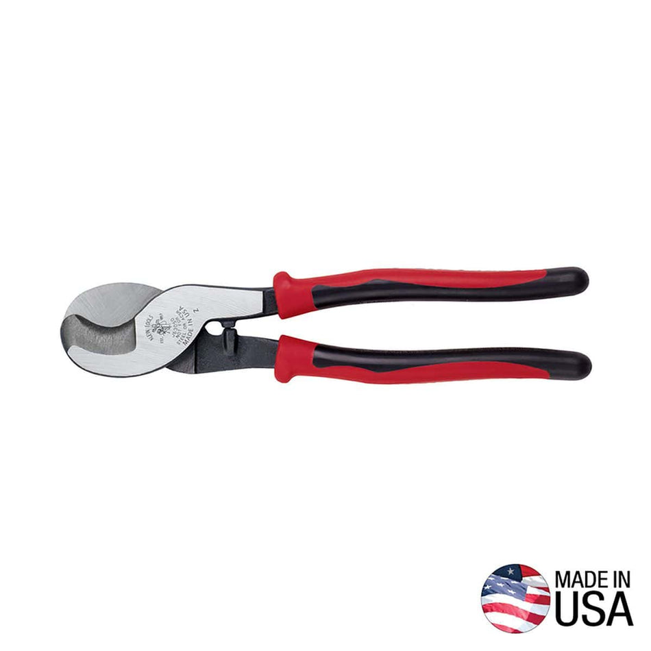 A professional side profile of the Klein Tools J63050 Journeyman cable cutter, featuring ergonomic red and black dual-material handles and forged tool steel hook-jaw blades designed for one-handed shear cutting, with a Made in USA logo.
