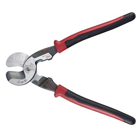 A wide-angle product shot of the Klein Tools J63225N Journeyman cable cutter with the jaws fully open, highlighting the specialized cable-gripping cutting profile and integrated stripping hole.