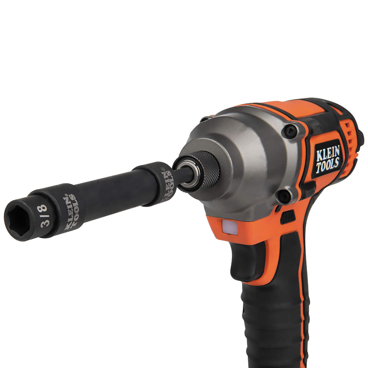 Klein Tools 1/4-inch cordless impact driver fitted with an impact adapter, extension bar, and 3/8-inch pass-through socket.