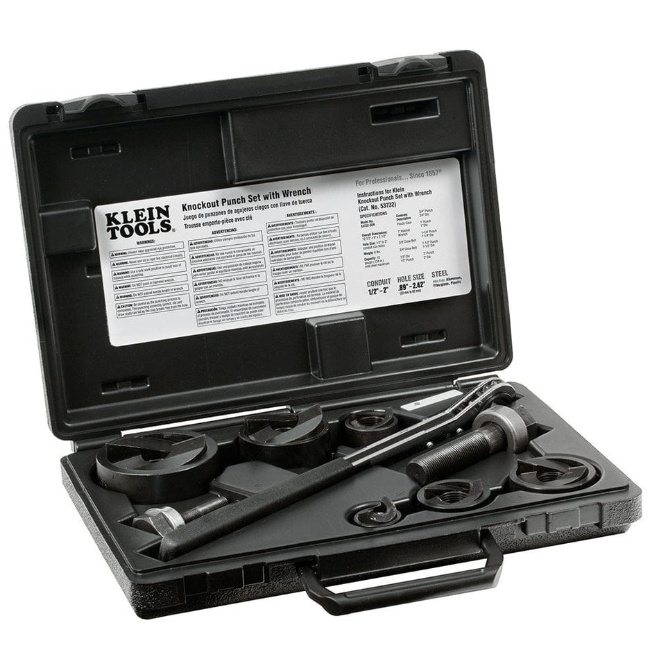 The image shows a black plastic carrying case, open to reveal a set of metal tools inside. The tools, which include various round punches and a wrench, are neatly arranged in molded compartments within the case. A white label with black text is visible on the inside lid of the case, featuring the "Klein Tools" logo.