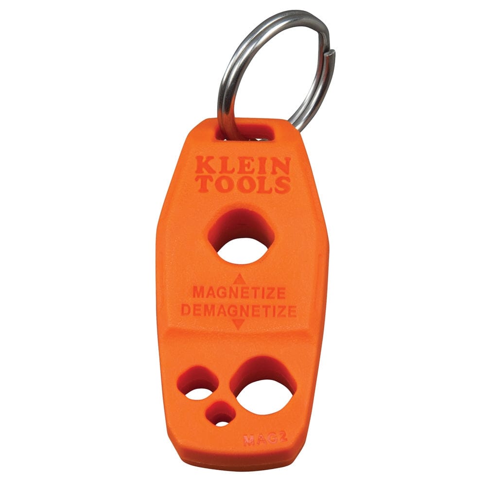 A direct front view of the orange Klein Tools MAG2 magnetizer/demagnetizer tool featuring a central magnetization hole, a smaller demagnetization hole, and a silver stainless steel key ring attached to the top.