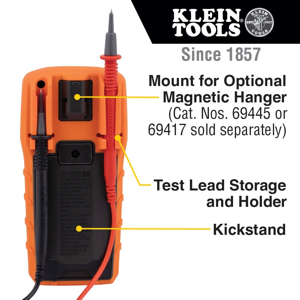 Rear view infographic of the MM325 highlighting back-of-tool features with yellow lines. Labels indicate a mount for an optional magnetic hanger, integrated test lead storage and holder, and the fold-out kickstand.