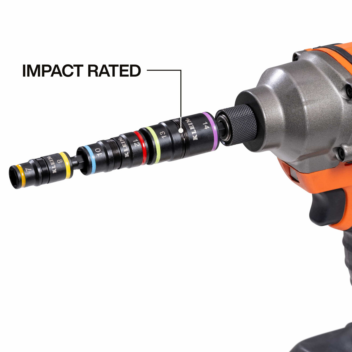 Klein 32933M 6-in-1 metric flip socket attachment mounted in a cordless impact driver chuck to highlight high-torque power tool compatibility.