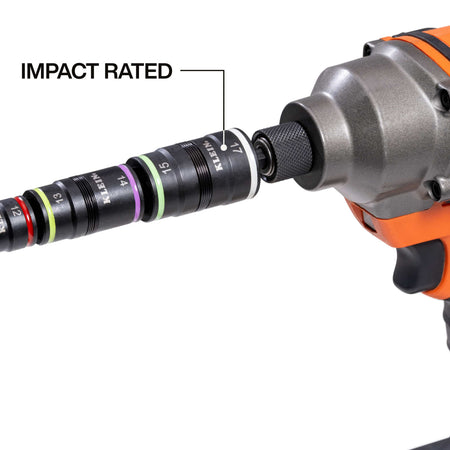 Klein 32934M 8-in-1 metric flip socket set mounted in a cordless impact driver chuck to highlight high-torque power tool compatibility.