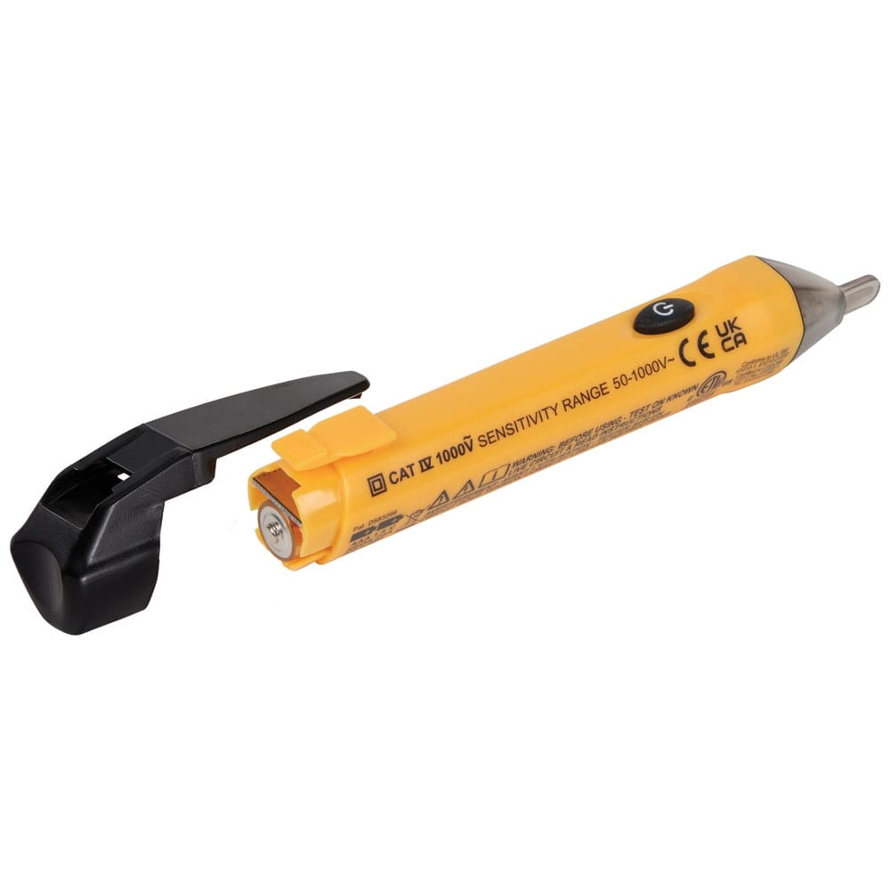 The Klein Tools NCVT1P voltage tester shown with the rear battery compartment open, revealing the placement of the two included AAA batteries. The device clearly displays the CAT IV 1000V sensitivity range specifications.
