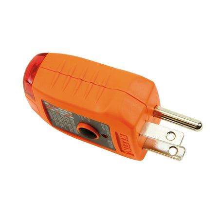 A side-angle view of the RT210 GFCI tester focusing on the ergonomic orange housing and the integrated electrical prongs. The compact design allows for easy insertion into standard residential and commercial wall receptacles.