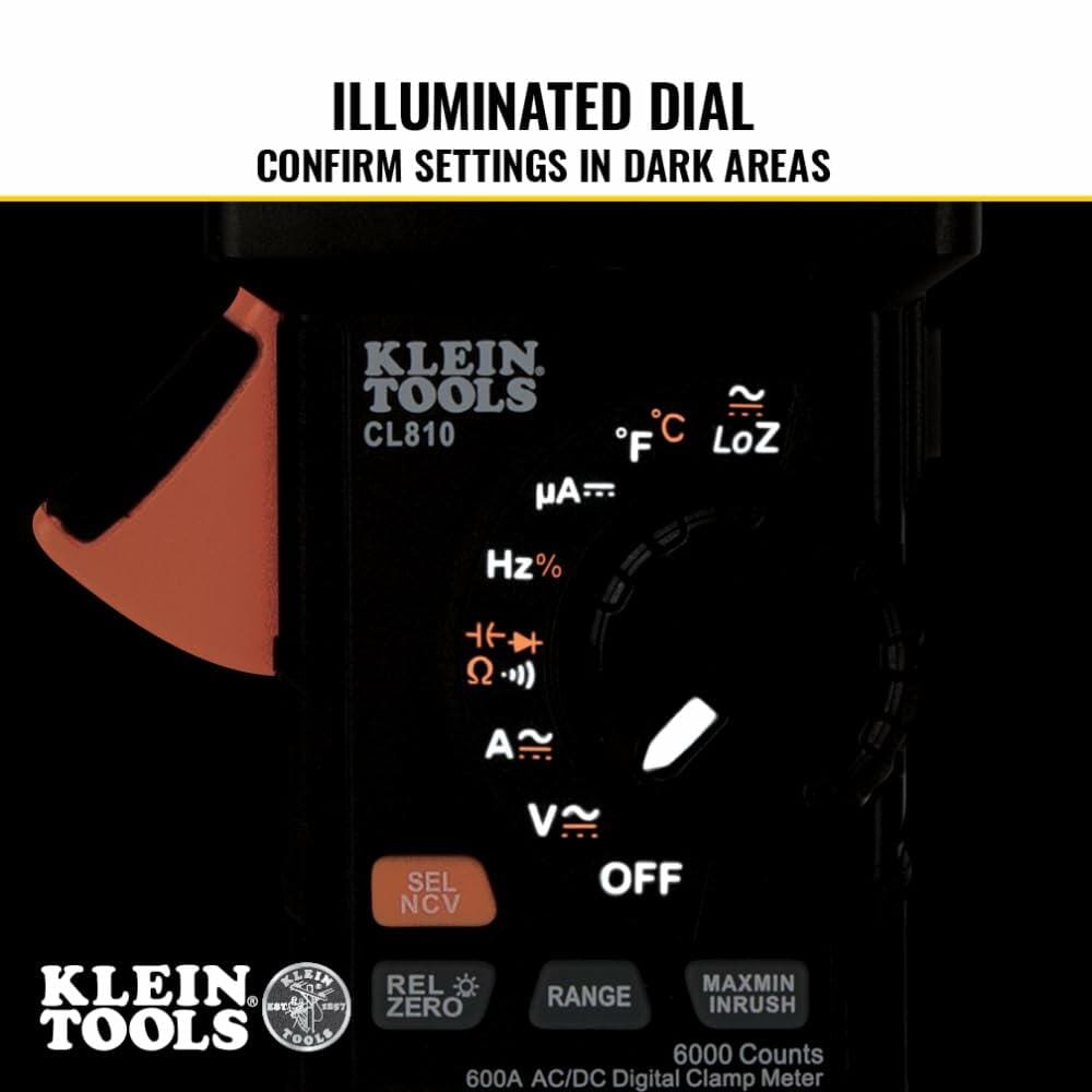 Close-up of Klein Tools CL810 clamp meter showing illuminated dial and display with multiple measurement settings for low-light visibility.