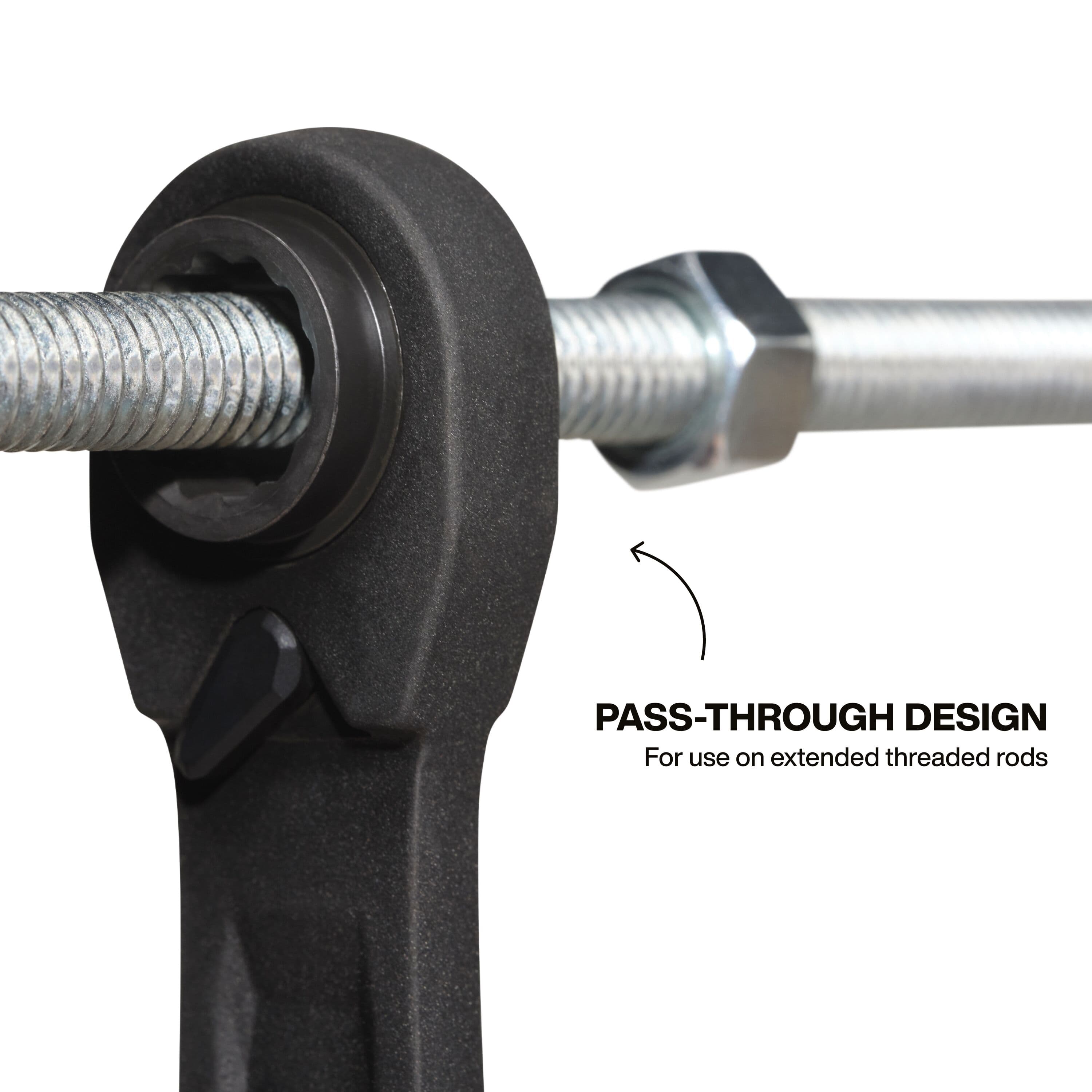 Close-up of a ratcheting box end running a nut down an all-thread rod to illustrate hollow pass-through depth clearance.