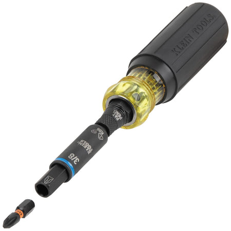 Klein Tools 32528HD screwdriver handle with a double-ended nut driver shaft inserted and a Phillips bit detaching from the quick-connect tip.