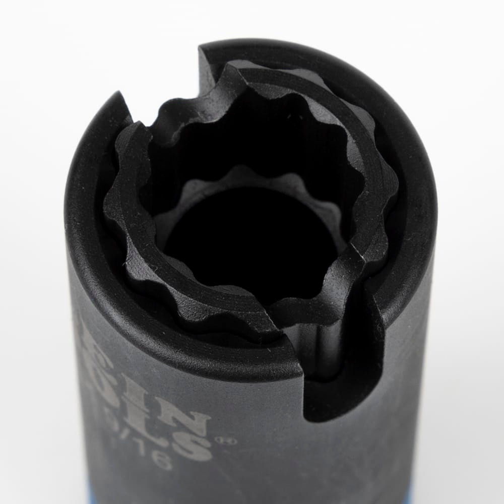 Close-up looking into the 12-point dual socket opening to demonstrate nested coaxial design and side alignment slot.