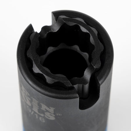 Close-up looking into the 12-point dual socket opening to demonstrate nested coaxial design and side alignment slot.