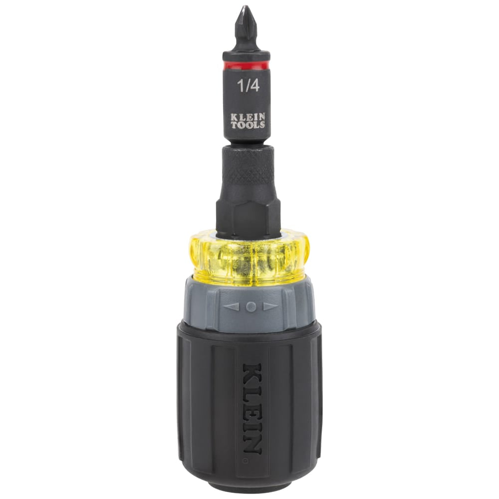 Klein Tools 32561HDRT ratcheting stubby multi-bit driver configured vertically with a 1/4-inch nut driver socket and Phillips driver bit.