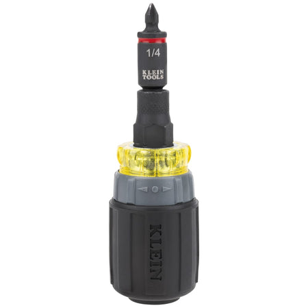 Klein Tools 32561HDRT ratcheting stubby multi-bit driver configured vertically with a 1/4-inch nut driver socket and Phillips driver bit.