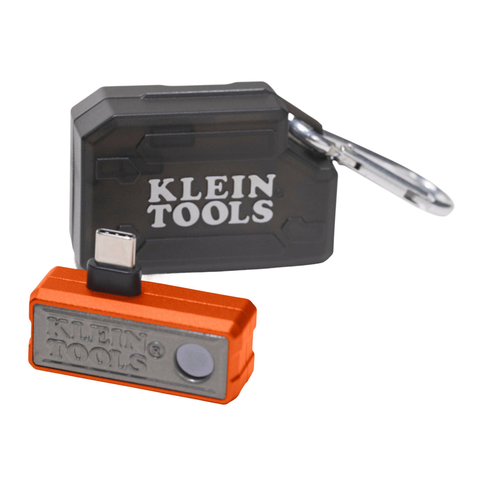 A studio product view of the Klein Tools TI223 Mobile Thermal Imager for smartphones. The compact orange and grey aluminum device features a USB-C connector and is shown alongside its rugged black hard storage case and metal carabiner for professional portability.