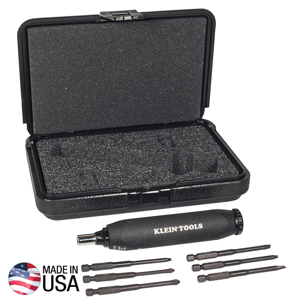 Klein 57032 torque screwdriver handle displayed beside six 3.5-inch power bits and open foam-lined case for safe storage.