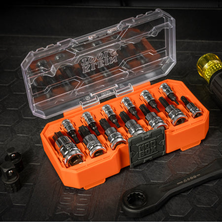 Klein 65213TX TORX set open on a jobsite workbench alongside a Cushion-Grip handle and pass-through wrench for flexible driving options.
