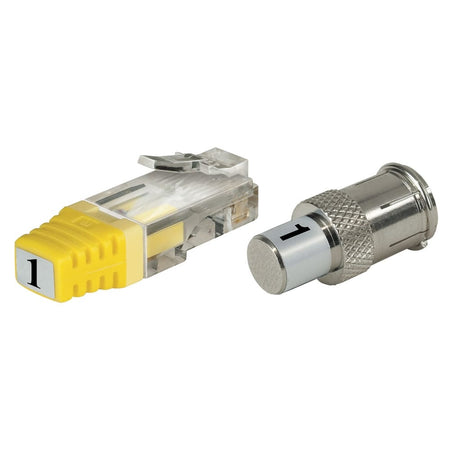 Close-up product shot of two small individual remotes from the VDV501-825 kit on a white background: a clear-bodied RJ45 data remote and a metal F-connector coax remote, both clearly numbered '1' on their yellow end-caps.