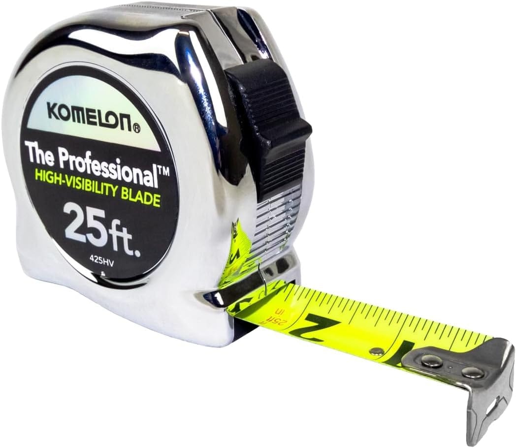 Studio view of the Komelon 425HV Professional tape measure featuring a polished chrome case and an extended neon yellow high-visibility blade with large black numbers.