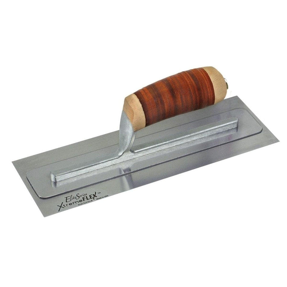 Studio view of the Kraft Tool Elite Series XtremeFLEX finishing trowel featuring a stainless steel blade with a top support plate and a contoured brown leather handle.