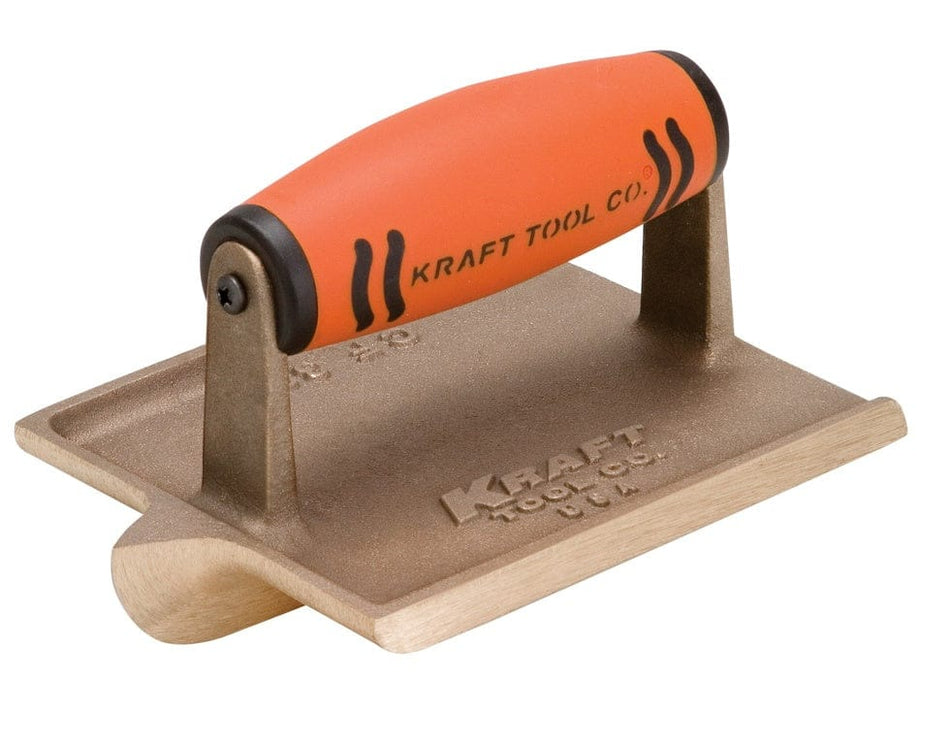 Angled studio view of the bronze hand groover featuring the orange ProForm handle and the deep cutting bit extending from the base.