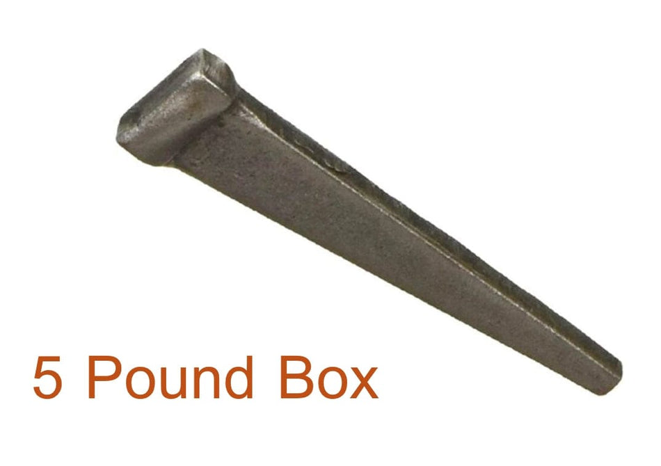 Single Kratos cut masonry nail with rectangular cross-section, tapered blunt point, and flat head. Text below reads "5 Pound Box" in orange, indicating packaging size. Nail has industrial finish, suitable for wood-to-masonry fastening in construction or restoration projects.