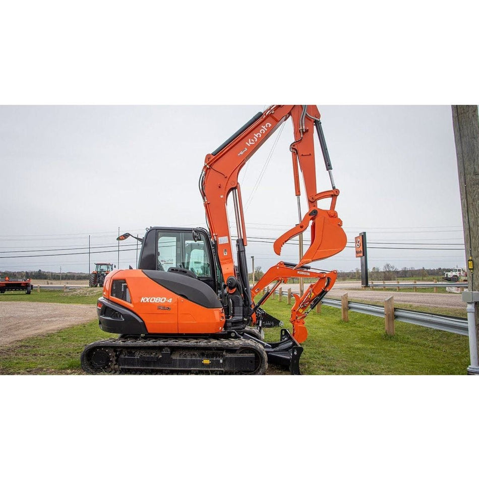 Kubota KX080-4 Power Utility Excavator resting on a large mound of dirt.