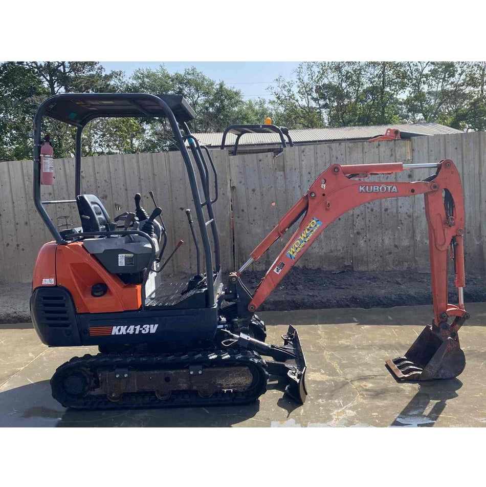Kubota KX41-3V Compact Mini Excavator on concrete near a fence