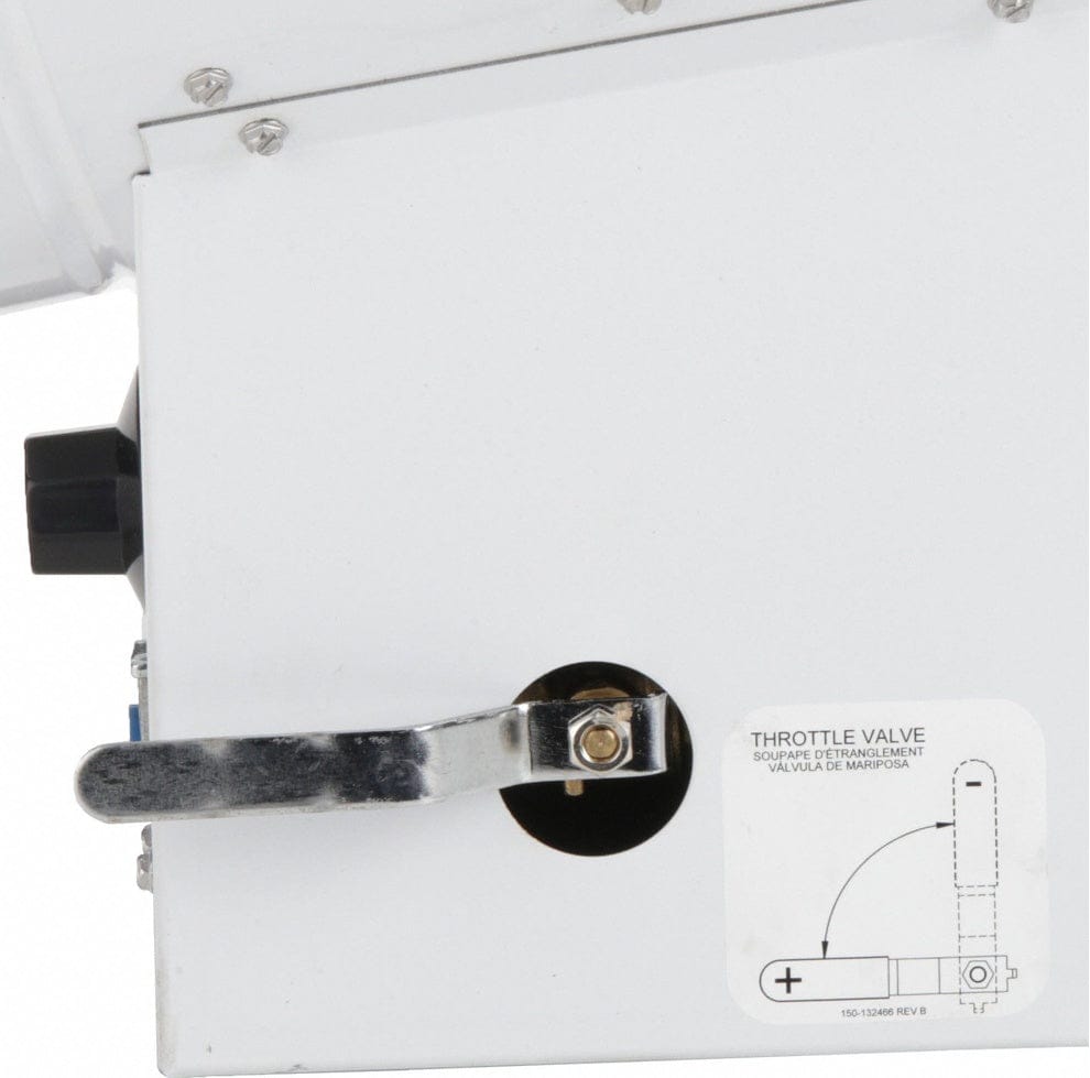 Close-up of the silver throttle valve lever on the side of the heater base, used for adjusting the variable heat output, with a diagram sticker explaining the valve position.
