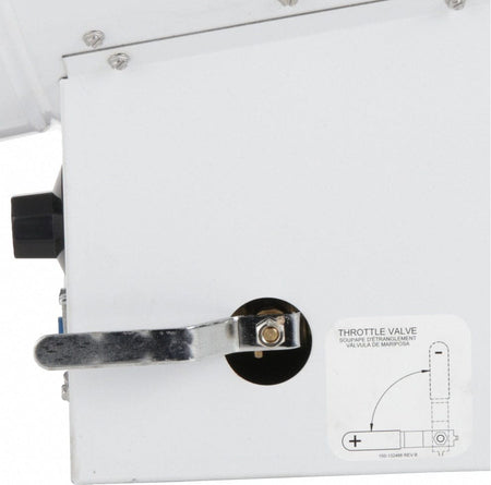 Close-up of the silver throttle valve lever on the side of the heater base, used for adjusting the variable heat output, with a diagram sticker explaining the valve position.