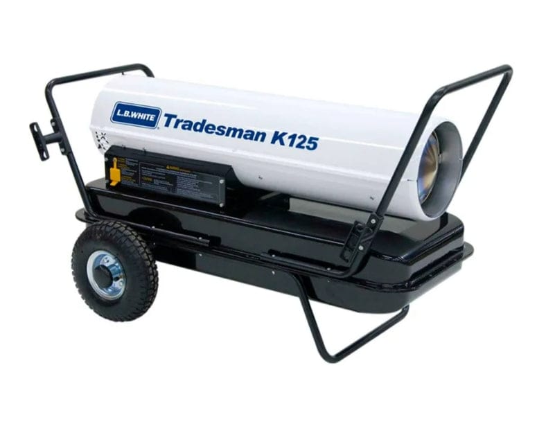 Side view of L.B. White Tradesman K125 portable forced air heater showing cylindrical heating unit, wheeled base, and maneuvering handle. Branding and model name are printed on the housing.