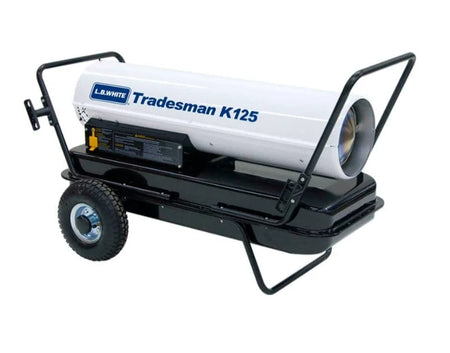 Side view of L.B. White Tradesman K125 portable forced air heater showing cylindrical heating unit, wheeled base, and maneuvering handle. Branding and model name are printed on the housing.