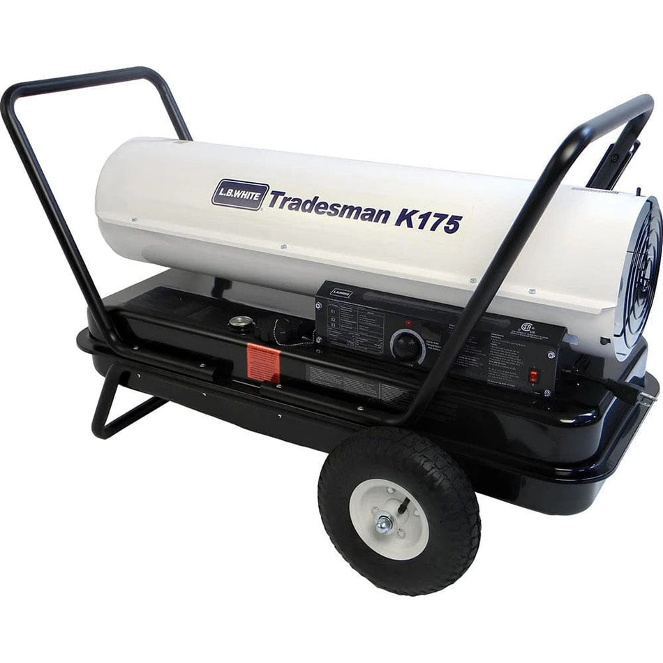 A side profile of the LB White Tradesman K175 forced air heater featuring a white cylindrical combustion chamber, black fuel tank base with no-flat wheels, and a integrated thermostat control panel for multi-fuel heating applications.