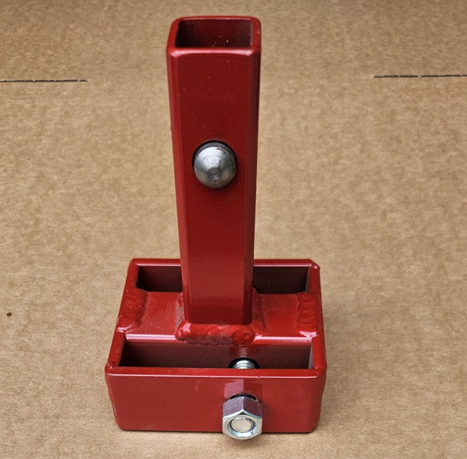 Front view of the Little Beaver 30320-C centered mobile home anchor adapter featuring a durable red powder-coated steel finish and a pre-installed securing pin for high-torque applications.