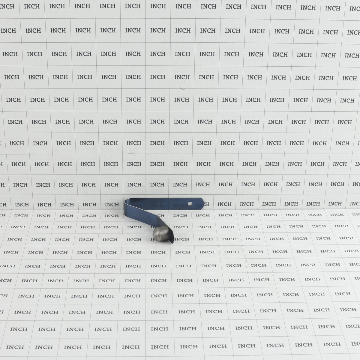 Little Beaver 9058 snap button assembly measured on an inch grid scale showing overall spring length and button height.