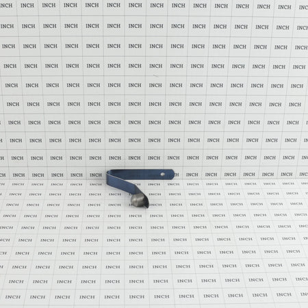 Little Beaver 9058 snap button assembly measured on an inch grid scale showing overall spring length and button height.