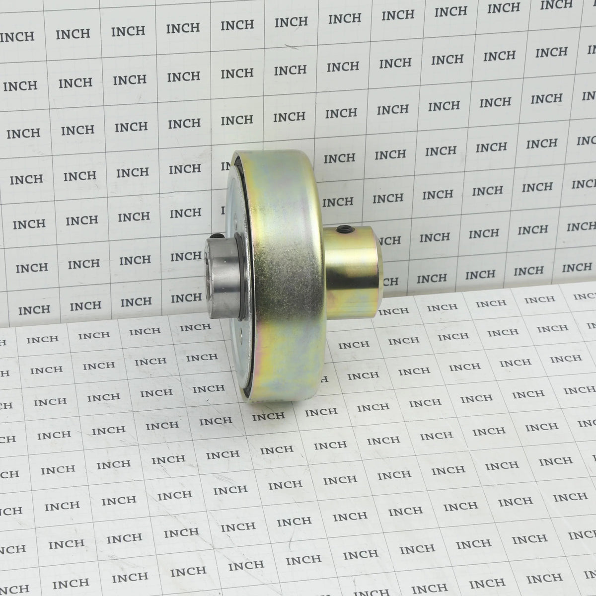 Assembled Little Beaver CCO-5# clutch and drum measured on an inch grid scale showing overall depth and hub diameter.